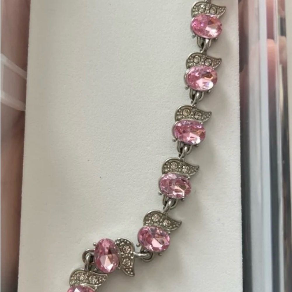 Pink and silver bracelet with accent on the side of the pink stones